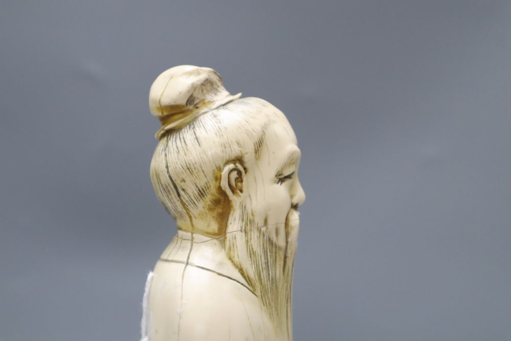 A Chinese simulated ivory figure of an elder, height 37cm
